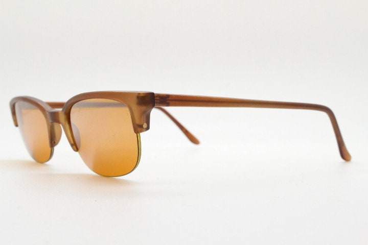 90s vintage low profile cat eye sunglasses. Transparent half frame cateye with matching mirror glazed light tone lenses. NOS