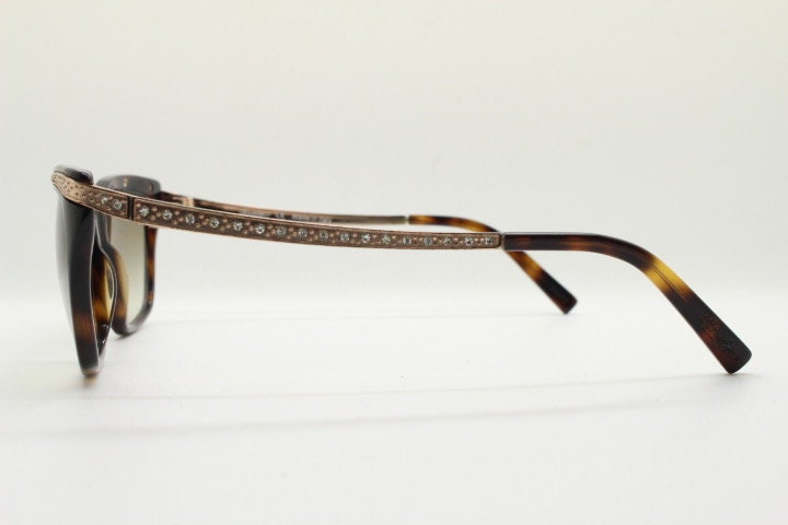 Borsalino cat eye sunglasses made in Italy model 250. Womens Tortoise acetate frame with dramatic diamante golden arms. Rhinestone cateye