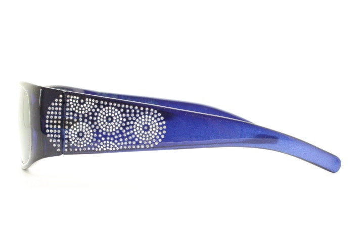 Assoluto 90s vintage wrap around rhinestone shield sunglasses made in Italy. Deep blue acetate frame with dazzling diamante circles. NOS