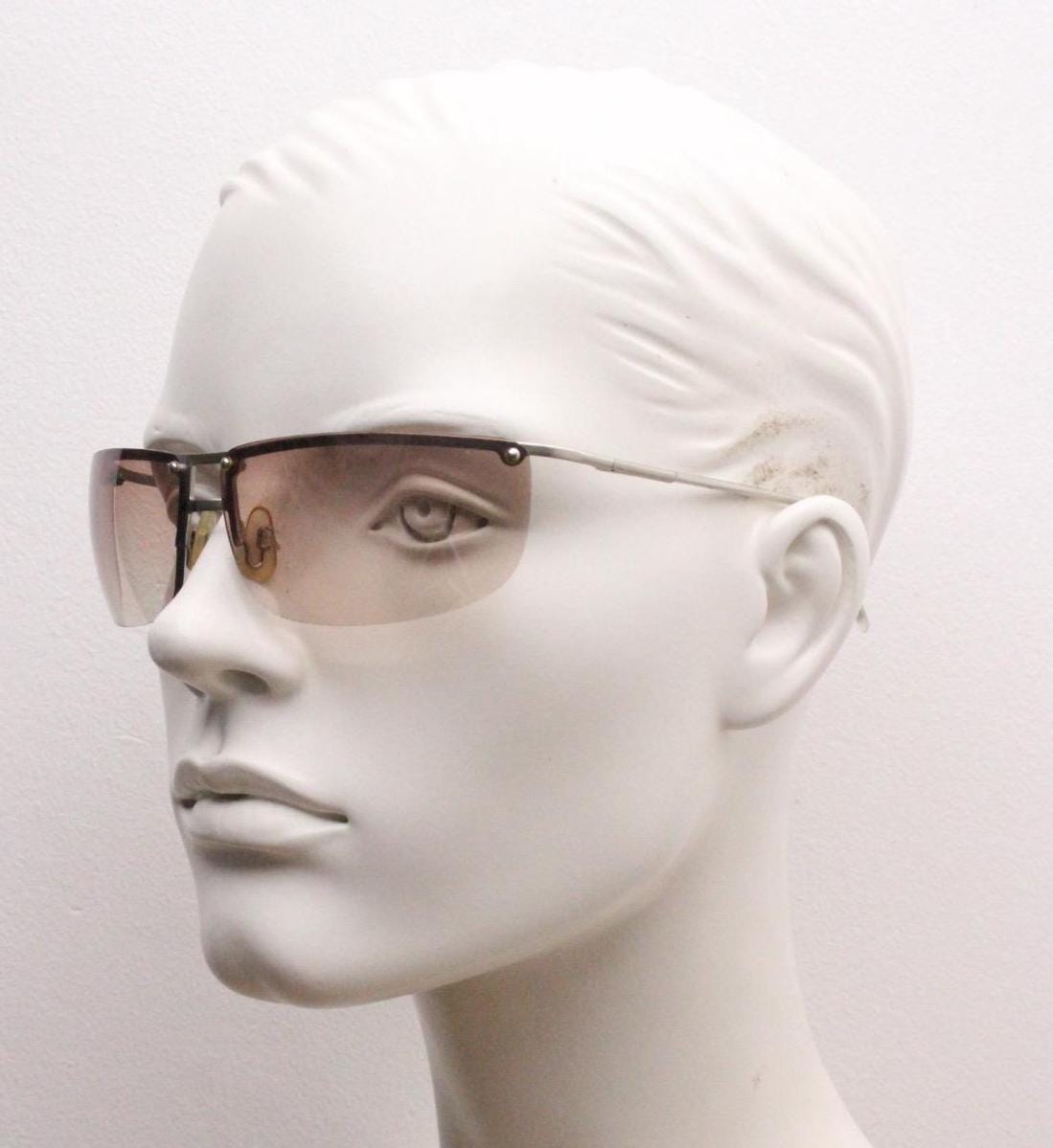 Y2K vintage visor sunglasses. Flat top half frame wraparound shield design with light tone graduating curved lenses. 2000's. NOS
