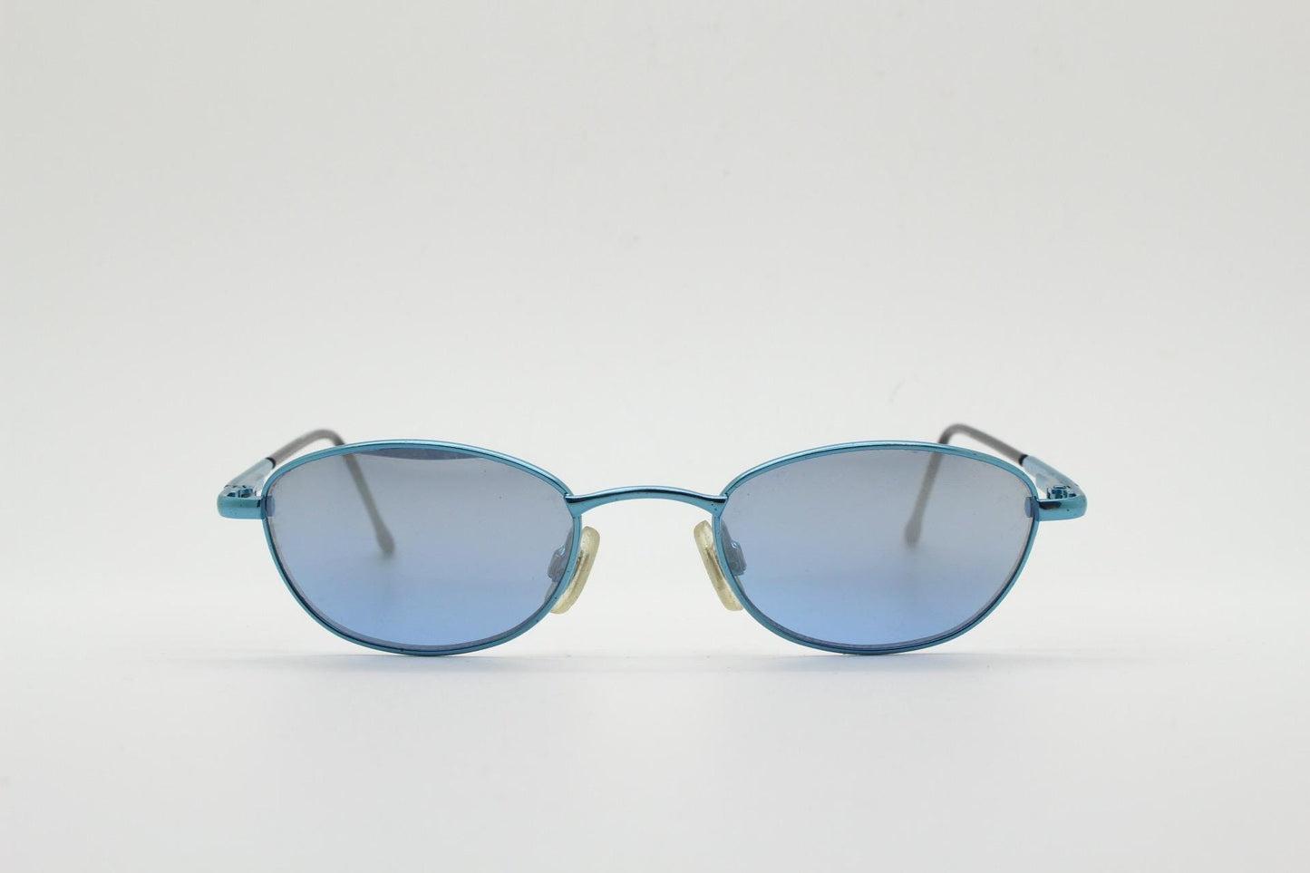 90s vintage small oval sunglasses by X-line. Unusual blue chrome metal frame with well matched mirror lenses. Quality NOS