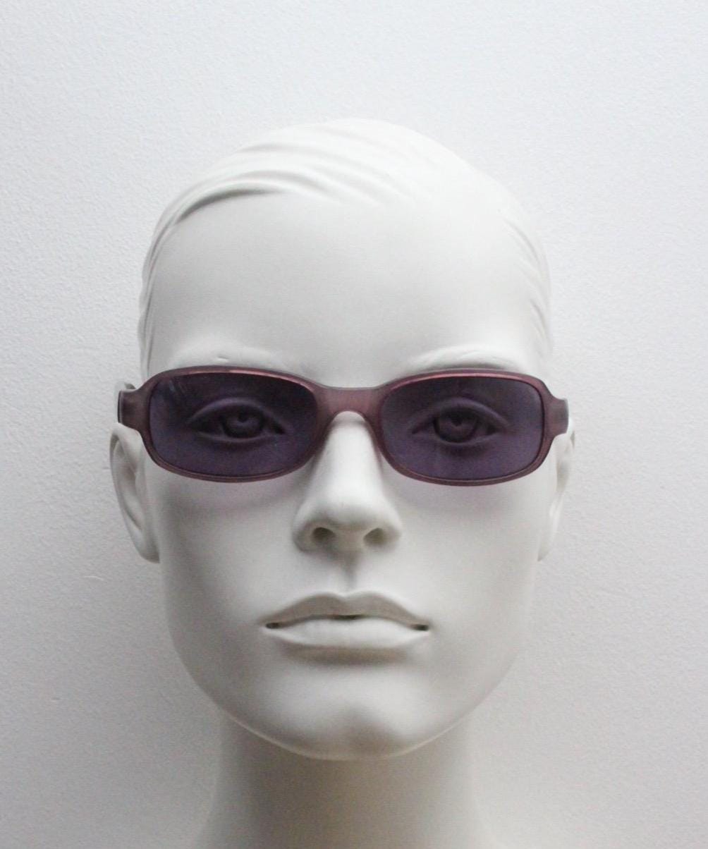Y2k vintage wrap around sunglasses. Curved low profile frame with extraordinary purple turtle arms and well matched lenses. 2000's NOS