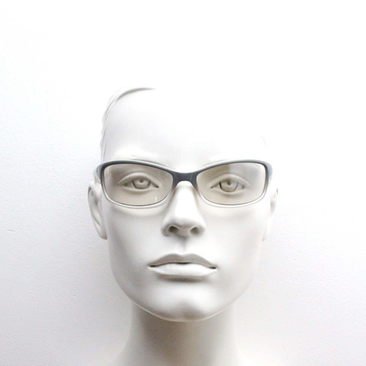 Y2K vintage futuristic sunglasses. Gloss white and grey wrap around shield style frame with light tone lenses. Cosplay visor. 2000s NOS