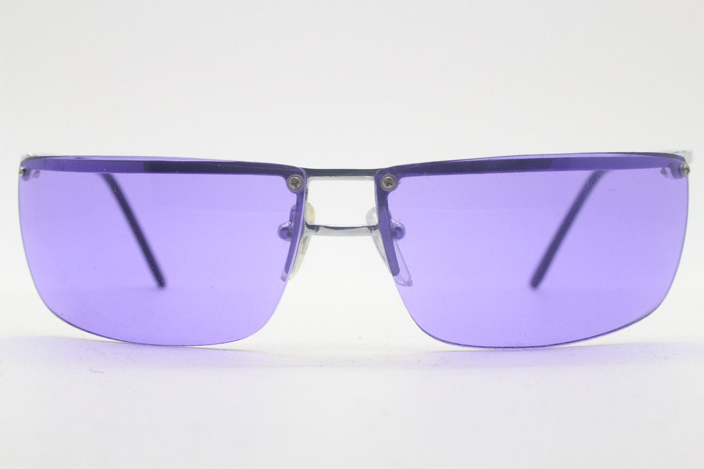 Y2K vintage purple shield sunglasses. 2000's half frame wraparound aerodynamic mini mask visor with curving lenses. 90s 00s unused NOS