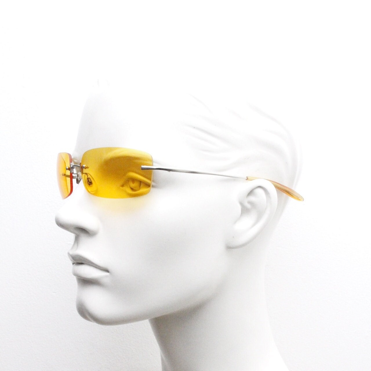 Y2K vintage frameless orange sunglasses. Rectangular wrap around lenses with satin silver bridge and arms. 2000s club kids. 00's. 90s. NOS