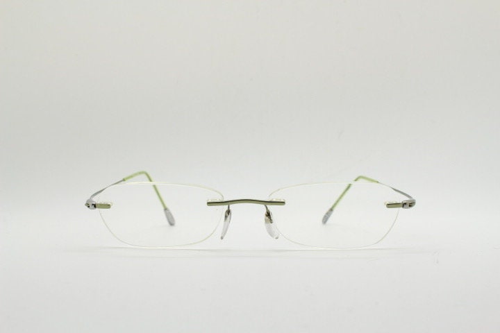 Silhouette rectangular frameless eye glasses made in Austria. Minimal lightweight optical frame with silver trim. Prescription RX