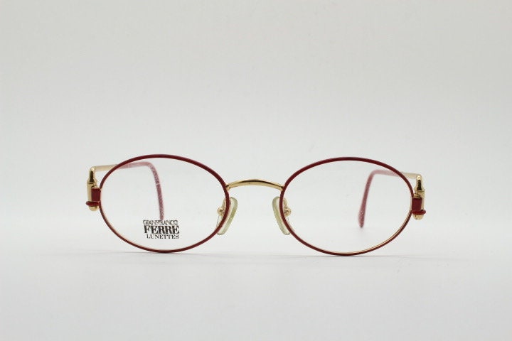 Gianfranco Ferre 90s vintage oval eye glasses made in Italy. Red and gold metal tech design optical frame. Prescription RX. NOS