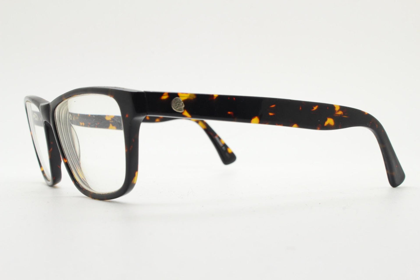 Cheap Monday rectangular low profile eye glasses. Dark brown tortoise gloss finish acetate optical frames. Prescription RX spectacles