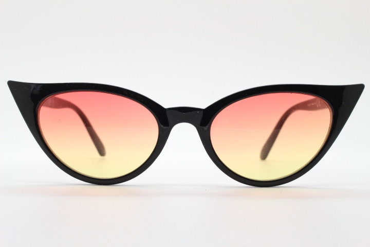 Y2K vintage pointed cat eye sunglasses. Womens black slender 50s design frame with pink to yellow ombre lenses. Rockabilly bad girl pin up