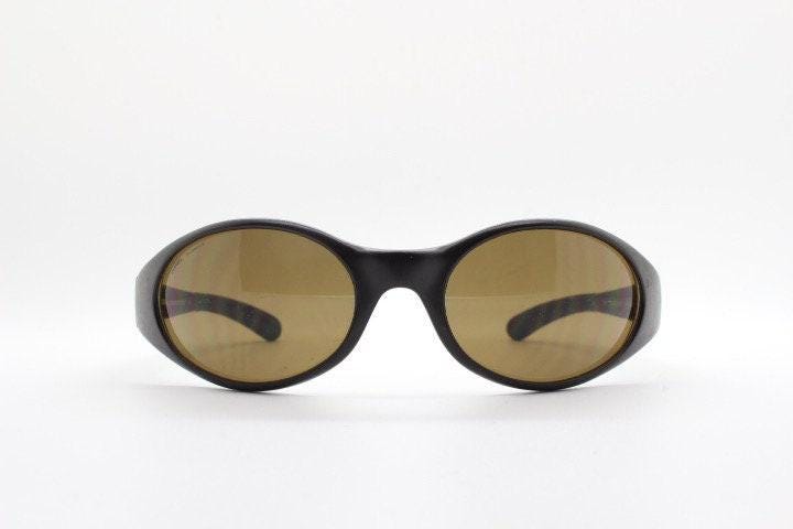 Carrera 90s vintage shield sunglasses made in Italy. Aerodynamic brown wrap around sport frame with big spell out logo. Bug eye. BNWT. NOS