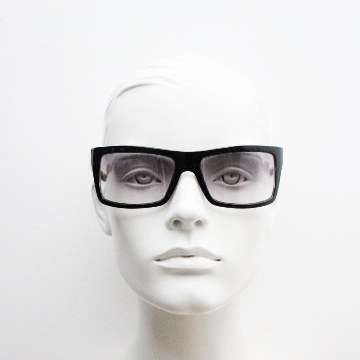 Y2k vintage wrap around large rectangular sunglasses. Curved black gloss frame with tasteful graduating lenses. 2000's NOS