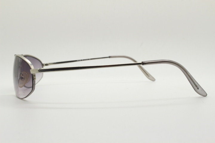 90s vintage modified extra small aviator sunglasses made in the USA. Satin finish solid metal frame aviators with light tone smoky lenses