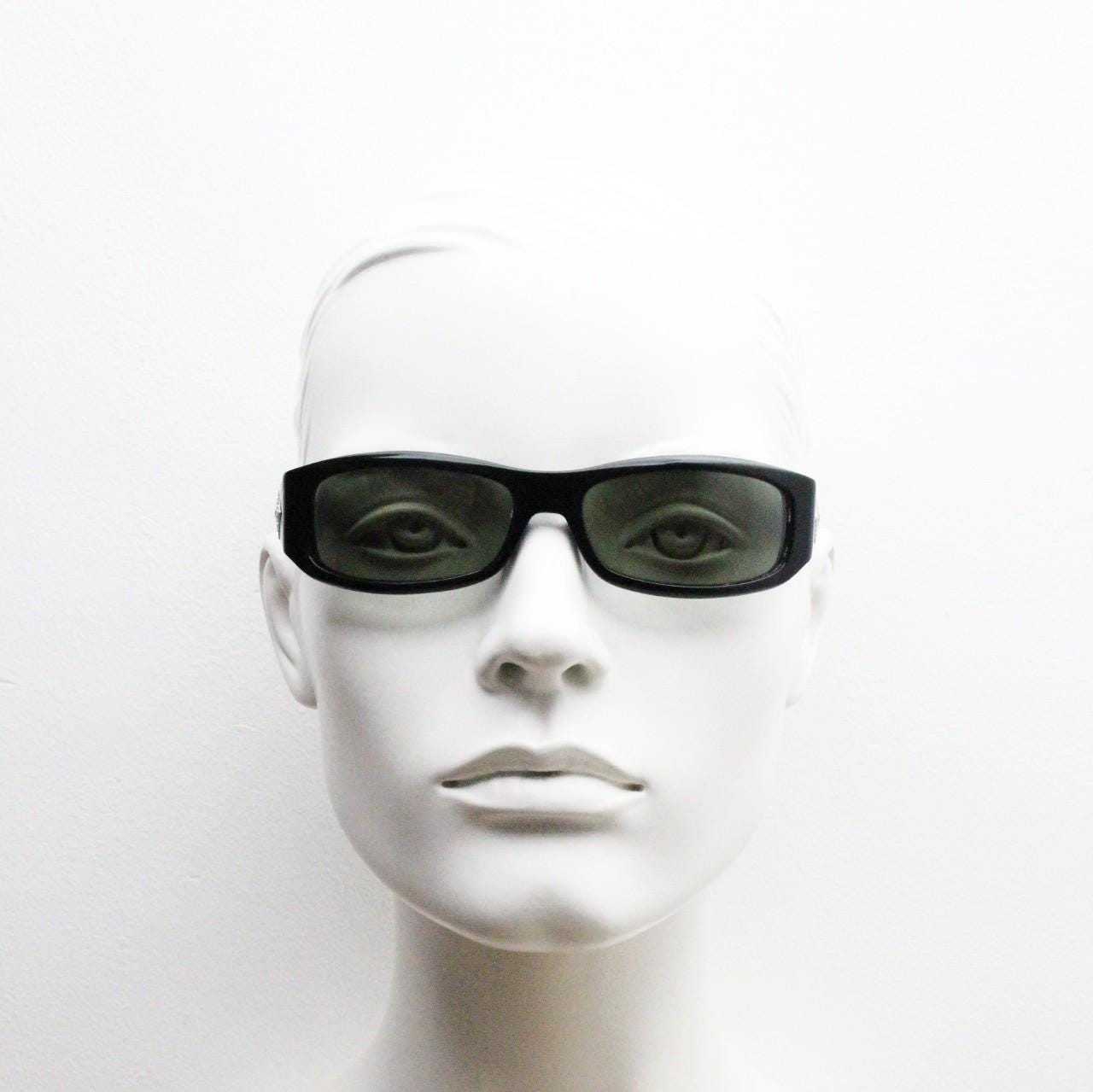 Pierre Cardin vintage 90s wrap around sunglasses made in Italy. Black acetate shield frame with quilted arms and diamante crest. NOS