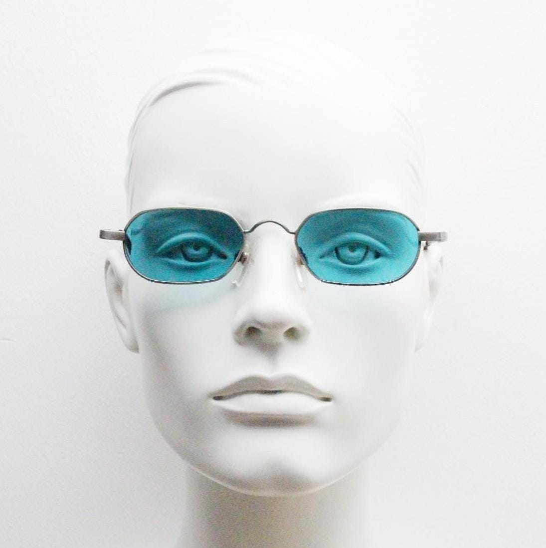 90s vintage small angular oval sunglasses by Blue Point. Low profile brushed bronze finish metal frame with turquoise blue lenses, NOS