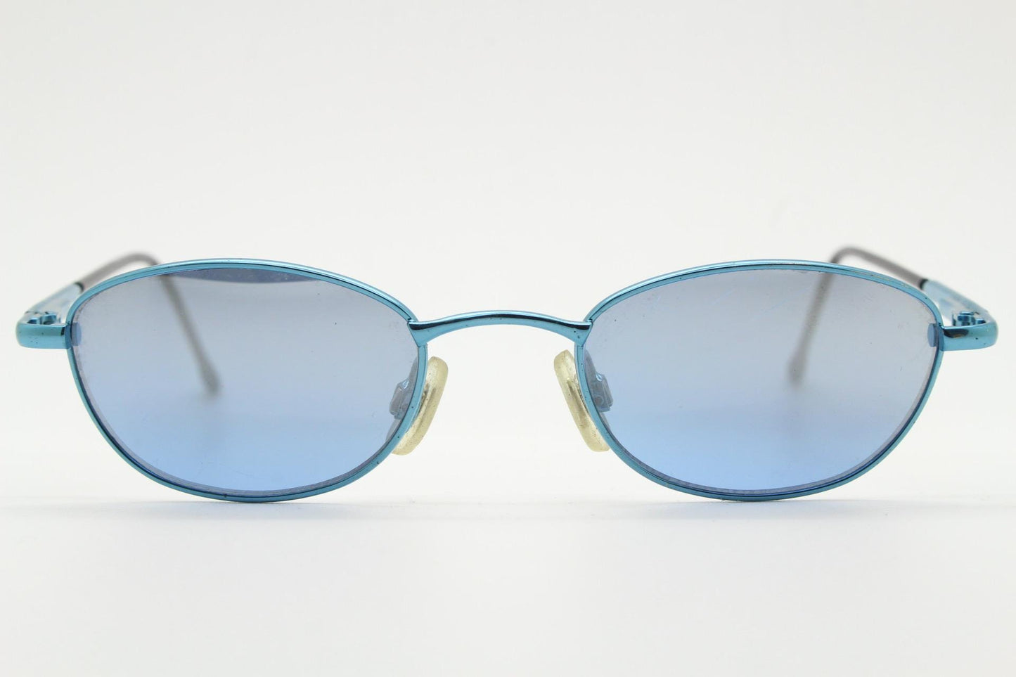 90s vintage small oval sunglasses by X-line. Unusual blue chrome metal frame with well matched mirror lenses. Quality NOS