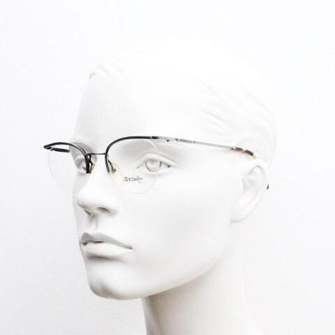 Sting 90s vintage round eye glasses. Minimal pewter finish metal half frame brow line optical frames. Prescription eyeglasses. RX. NOS