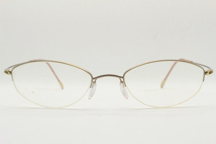Silhouette oval half frame eye glasses model 6608 made in Austria. Minimal optical frame with extremely flexible wire arms. Prescription RX