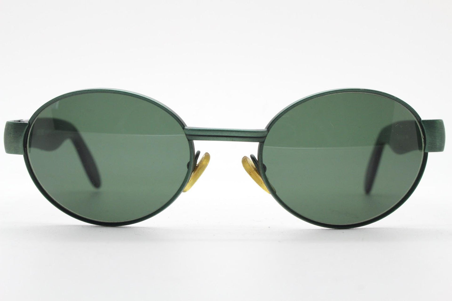 Safilo for Oxydo 90s vintage oval sunglasses made in Italy. Green matt finish solid metal frame with black arms and green lenses. Unused NOS