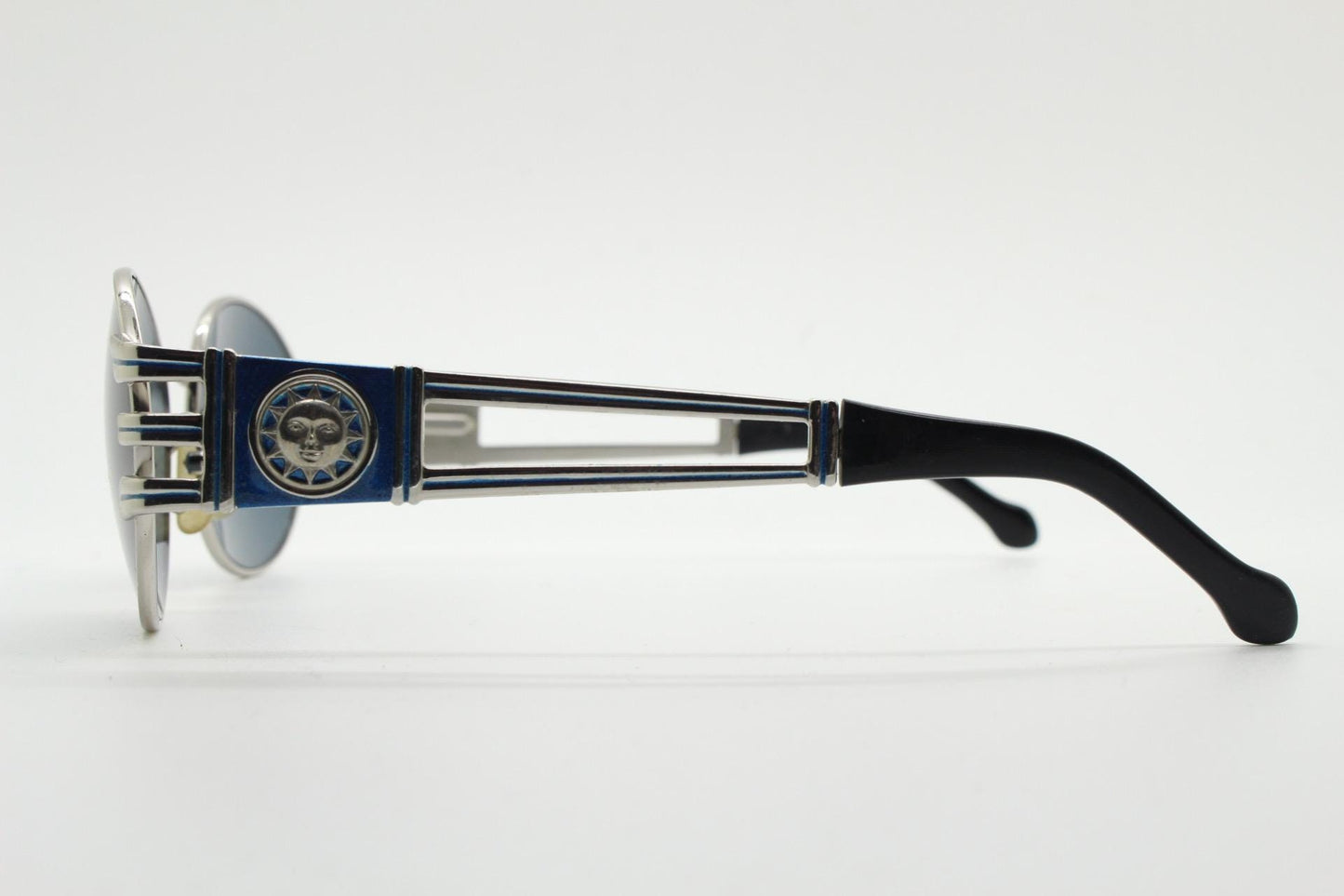Sunsweet 90s vintage metal oval sunglasses made in Italy. Definitive ornate temple design with classical sun crests in silver chrome. NOS