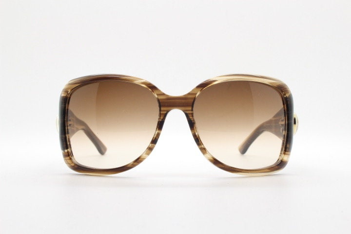 Gucci Y2K vintage oversized square sunglasses made in Italy. Transparent mottled brown frame with glitter sparkles and big stand out logo
