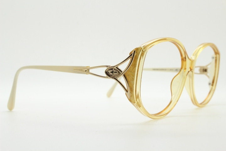 Christian Dior 70s vintage big round eye glasses made in Austria. Brown Optyl optical frames with distinctive logo. Prescription RX. NOS