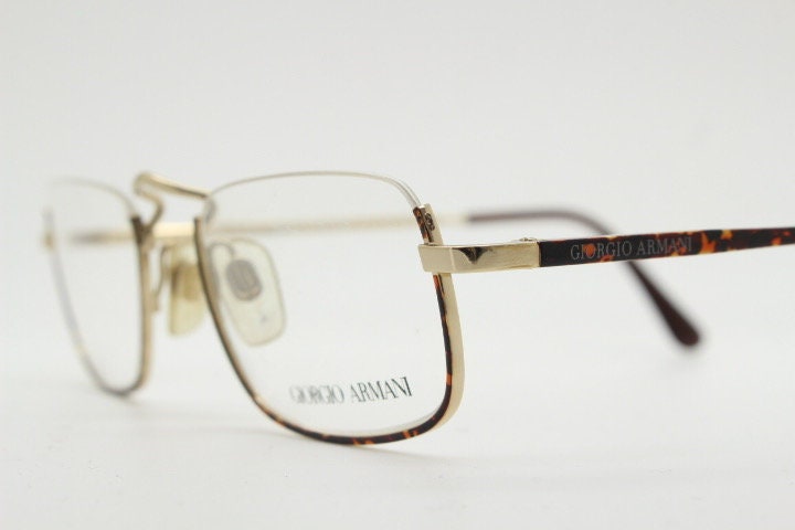 Giorgio Armani rectangular eye glasses made in Italy. Half frame underwire with metallic tortoise enamel. Prescription optical eyeglasses RX
