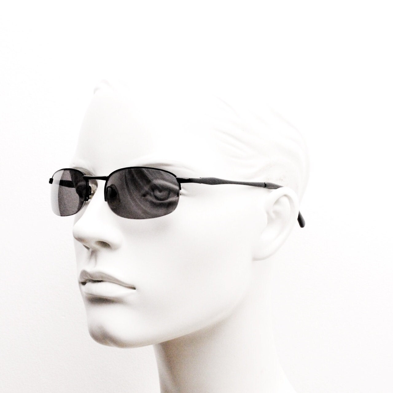 90s vintage small oval black sunglasses. Satin finish half frame with grey lenses and slight mirror glaze. 2000's. Y2K. Unused NOS
