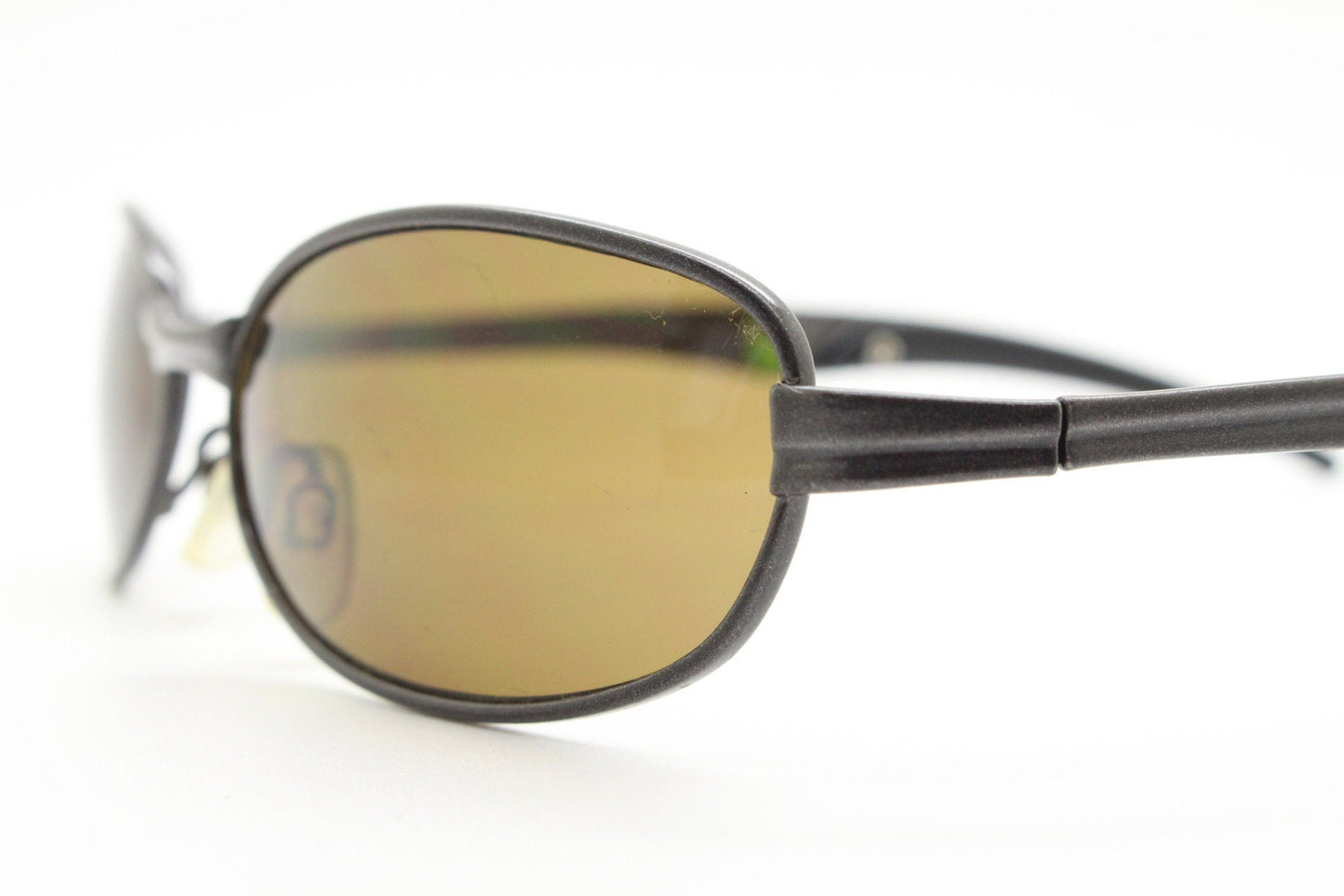 90s vintage oval small bug eye sunglasses. Curved brown satin finish solid metal frame with spear point rubber ends. Steampunk. Quality NOS