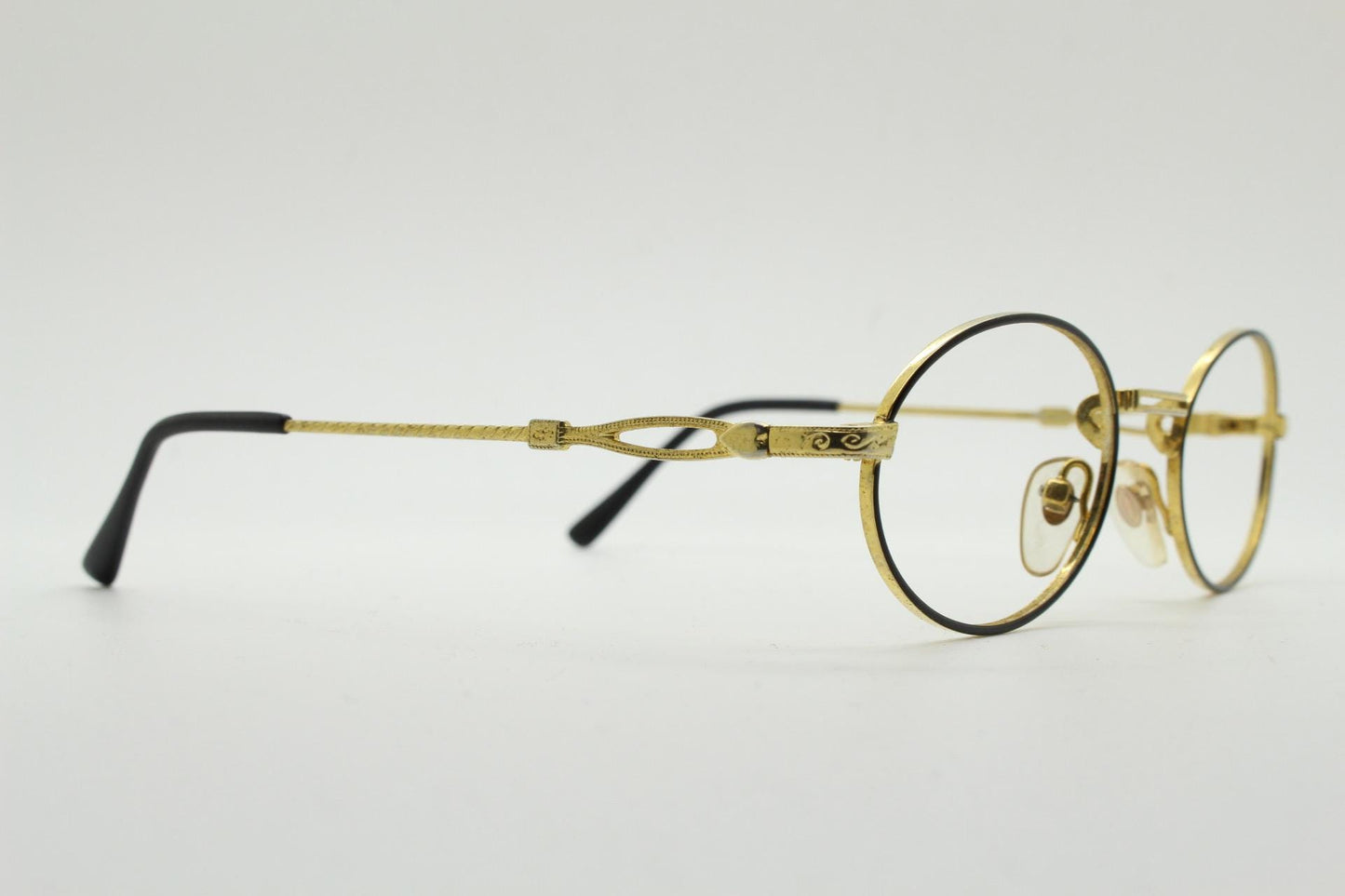 90s vintage small oval eye glasses. Gold and black optical frames with ornate arm details. Prescription RX steampunk spectacles. NOS