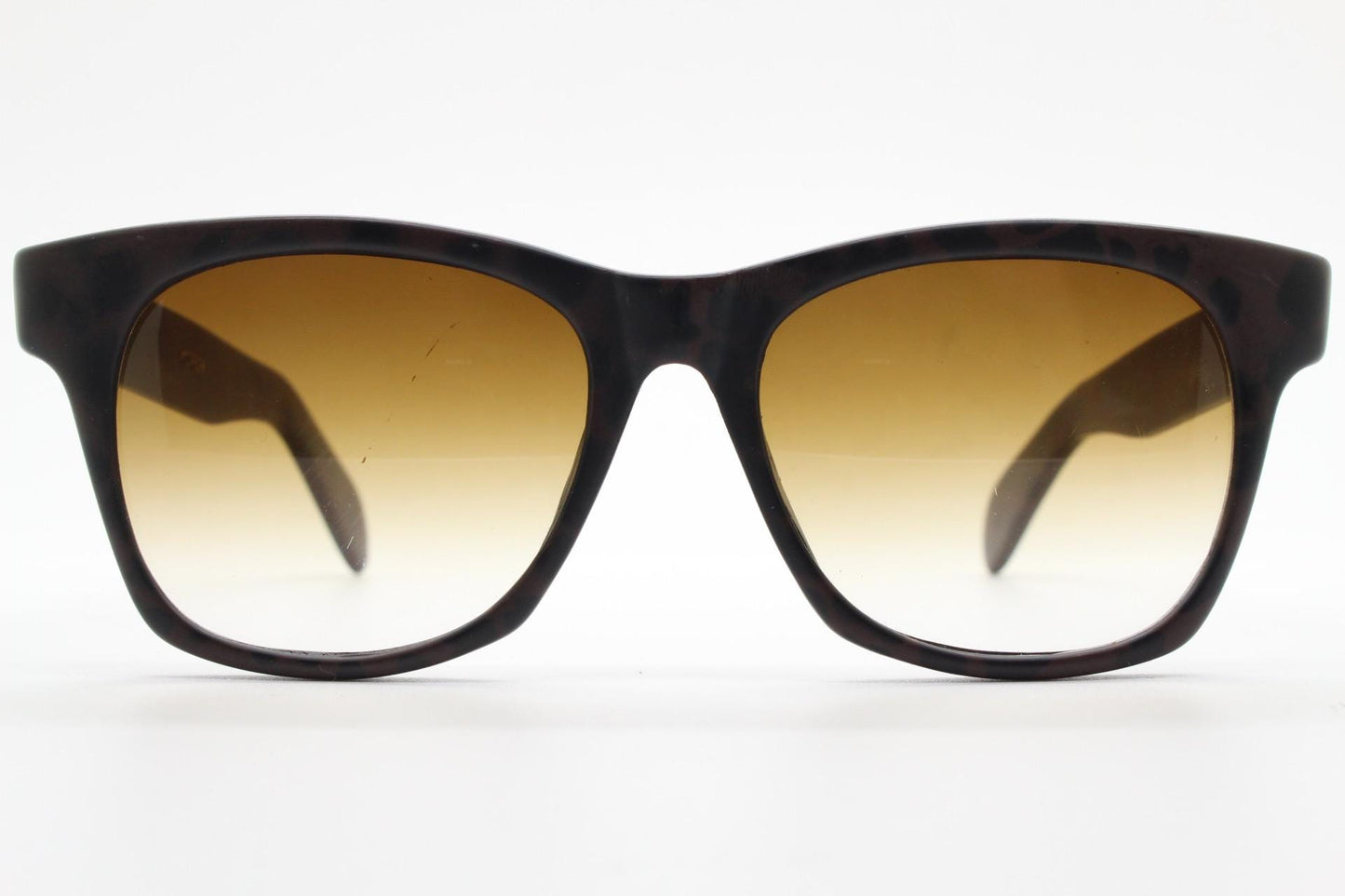 Vintage 80s square horn rim sunglasses. All time classic design in chunky matt black and brown frame with superb graduating lenses. NOS