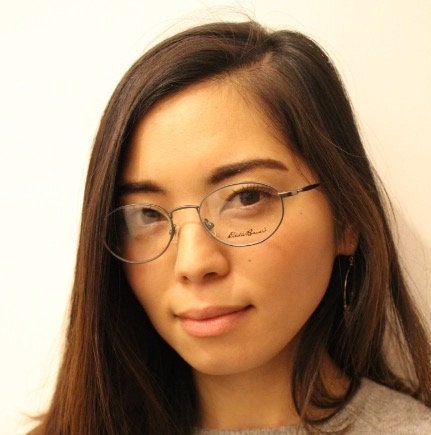 Eddie Bauer 90s vintage oval eye glasses. Minimal black matt finish optical frames with kinked arms. Stainless steel spectacles. NOS