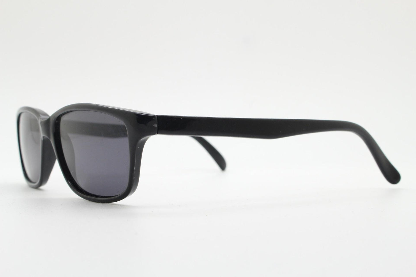 Vintage 90s slim rectangular modified wayfarer design sunglasses made in Italy. All black gloss low profile acetate frame. Unused NOS