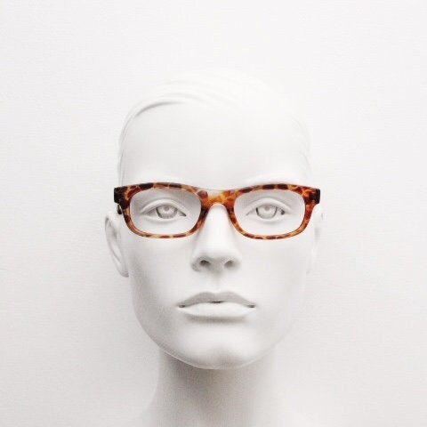 90s vintage rectangular low profile eye glasses. Transparent optical frame with vibrant amber giraffe pattern. Prescription eyeglasses. RX