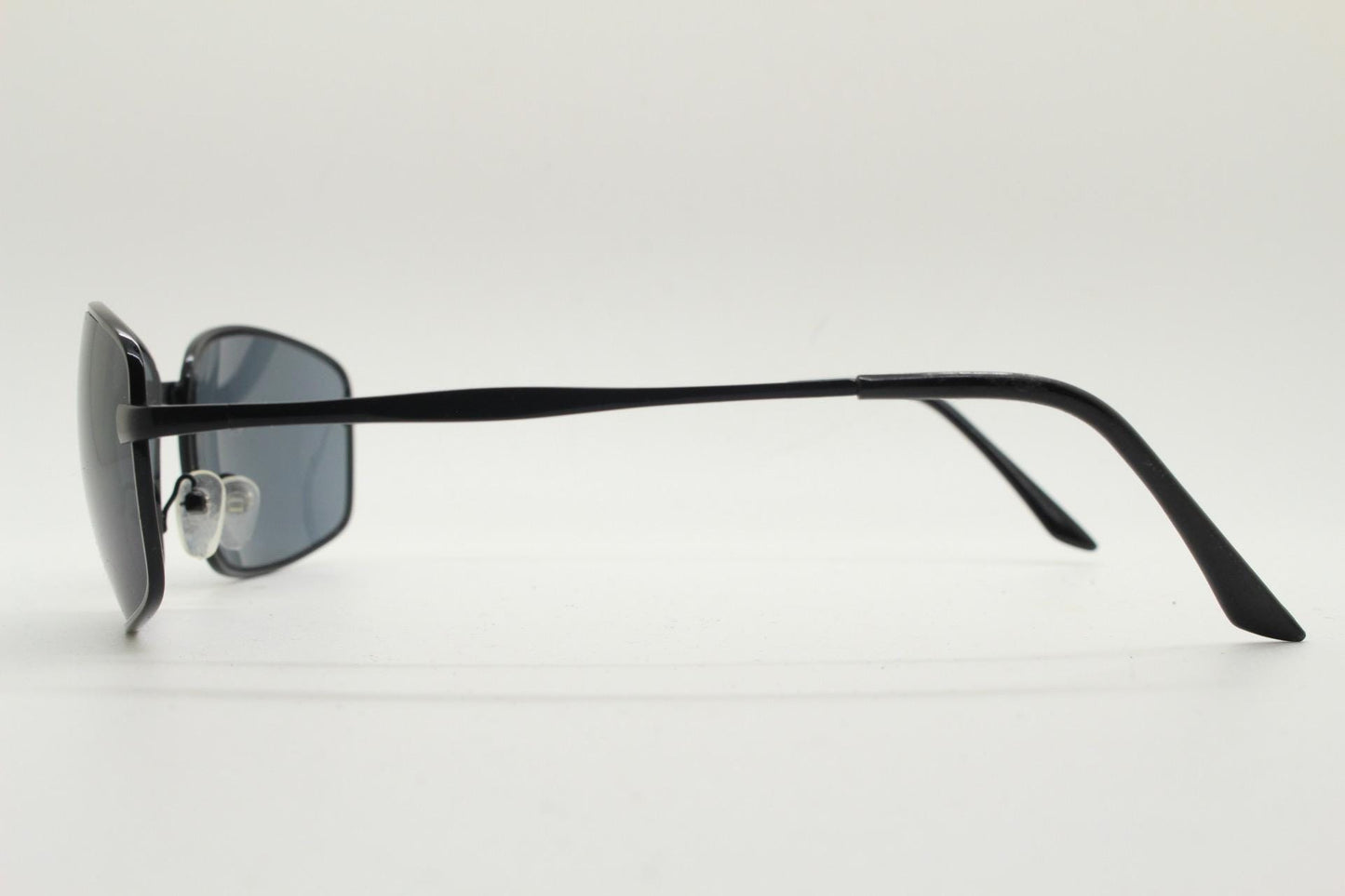 90s vintage wide rectangular sunglasses. Solid metal plain black gloss finish frame with curved lenses. 2000's. Y2K. NOS