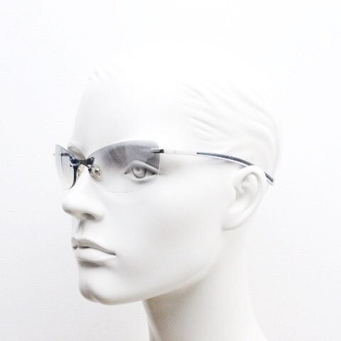 Y2K vintage wraparound sunglasses. Low profile frameless design in black matt finish with light tone graduated mirror lenses. 2000's. NOS