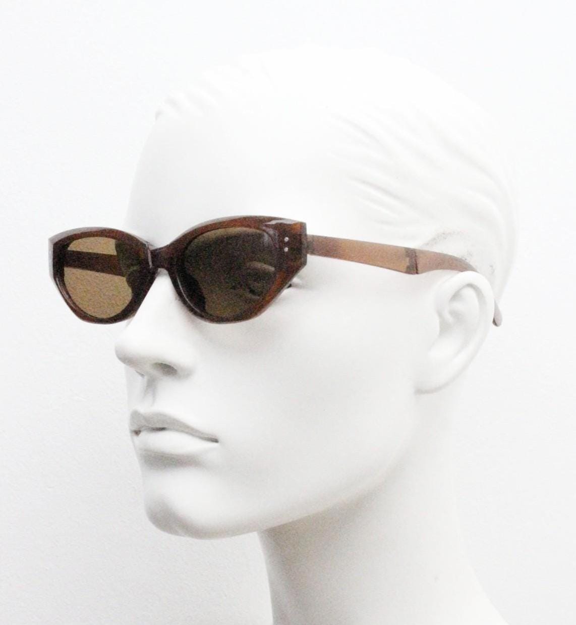 Vintage foldable cat eye sunglasses. Transparent brown folding compact cateye frame. Neat and clever folder design. Y2K NOS