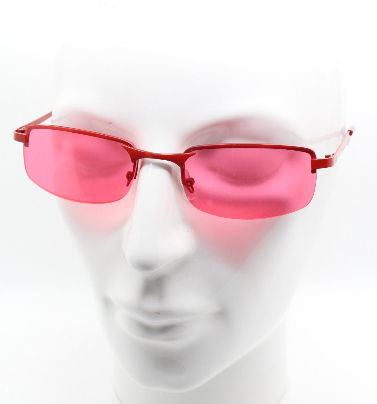 Y2K vintage half frame sunglasses with rectangular pink lenses and matching frame colours. 2000s NOS. 00's. 90s Rave