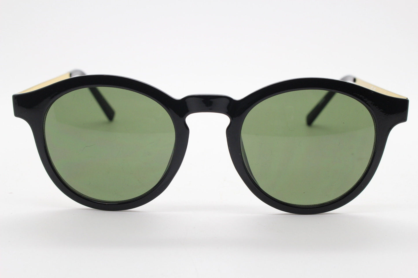 90s vintage round sunglasses. Black gloss frame with contrasting gold arms