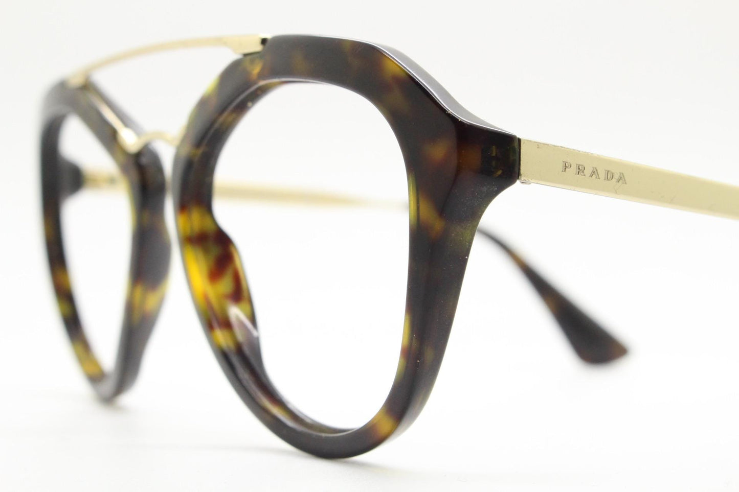 Prada angular eye glasses made in Italy. Thick tortoise acetate optical frames with prominent gold double bridge. Prescription. RX