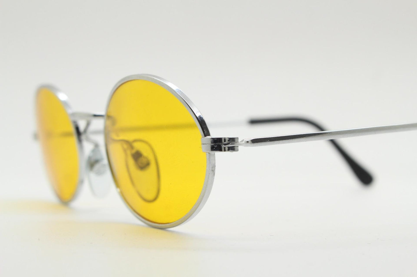 90s vintage small oval sunglasses. Minimal slender silver chrome metal frame with blazing orange lenses. Micro. Steampunk. Cosplay. NOS