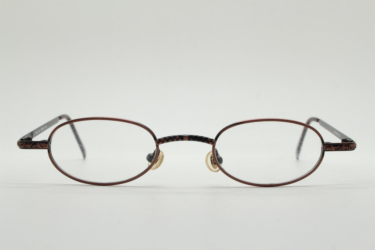 Paris Ma 90s vintage small oval eye glasses. Brushed copper finish optical frames with ornate details. Prescription steampunk spectacles NOS