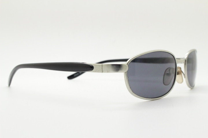 90s vintage small bug eye rectangular sunglasses. Satin finish silver frame with black gloss arms. Unused. 2000s. NOS