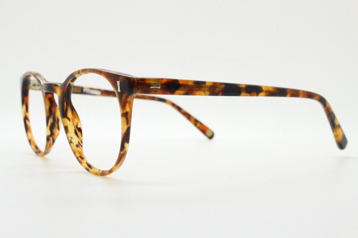 Cubitts vintage round 40s design hand made eye glasses. Honey tortoise acetate optical frame with keyhole bridge. Prescription RX