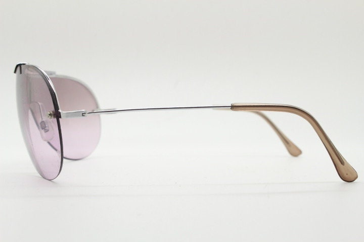 Y2K vintage visor shield sunglasses. Silver chrome half frame with pink wraparound mono lens and mirror glaze. Mini mask. 00's. 2000's NOS