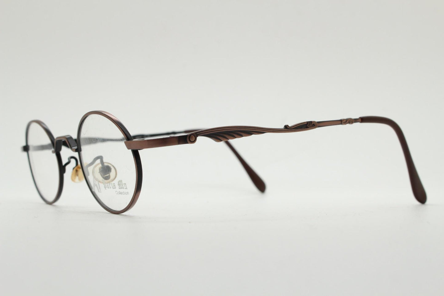 Paris Ma 90s vintage small oval eye glasses. Brushed bronze optical frames with scrolled arm details. Prescription. Steampunk spectacles NOS