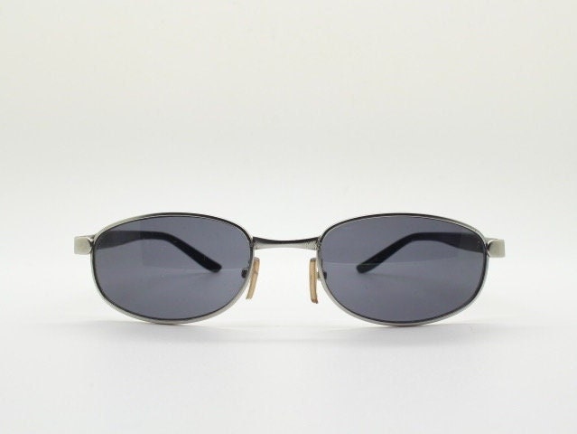 90s vintage small bug eye rectangular sunglasses. Satin finish silver frame with black gloss arms. Unused. 2000s. NOS