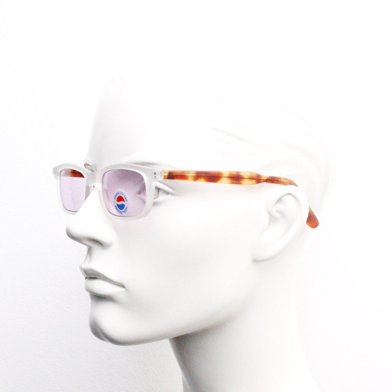 Pepsi 90s vintage sunglasses. Low profile rectangular frosted frame with tortoise arms and extra light tone purple lenses. Unused NOS
