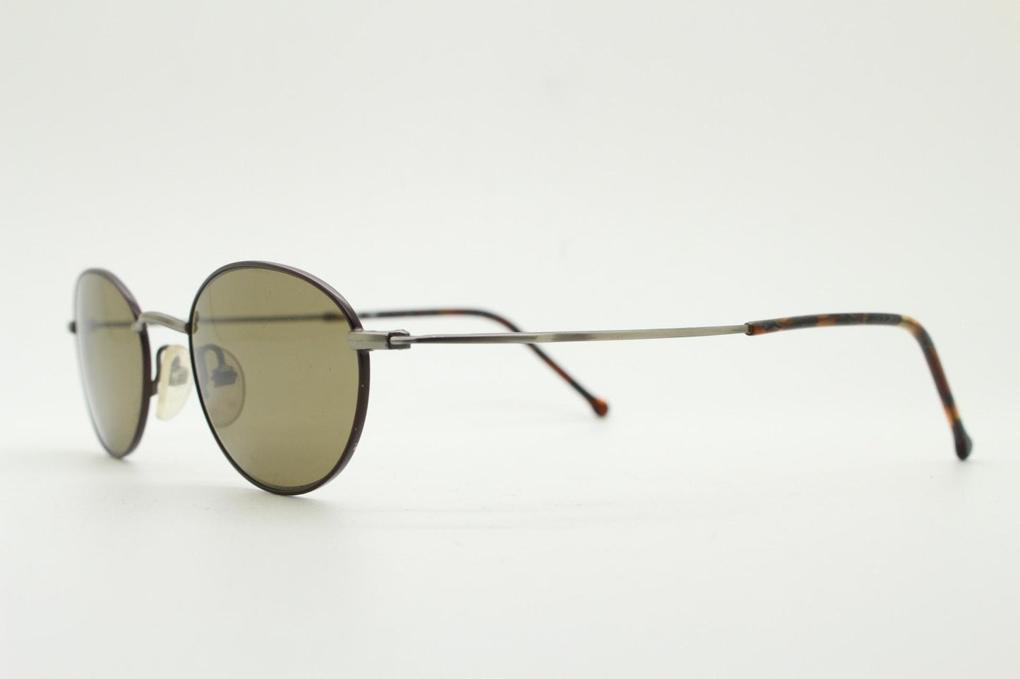 90s oval vintage metal sunglasses. Minimal satin finish bronze and brown metal frame with kinked curving arms. Steampunk. Unused NOS