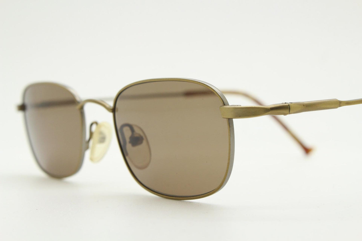90s vintage small rectangular low profile metal sunglasses. Minimal slim frame in satin bronze finish with plain brown lenses. NOS. BNWT