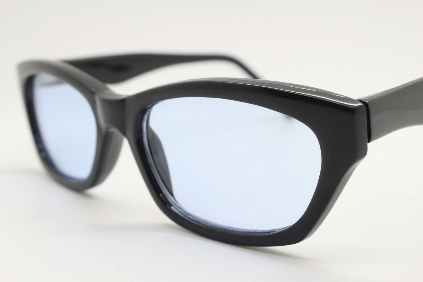80s vintage rectangular sunglasses. Low profile 60s design black gloss frame with extra light tone sky blue lenses. BNWT Unused NOS